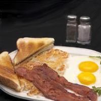 The Classic · Two eggs any style, with our home fries,  2 bacon strips or sausage links, and choice of toa...