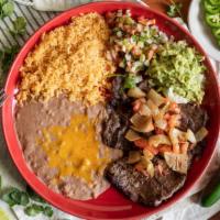 Carne Asada · 10 ounces of thinly cut broiled outside skirt steak, broiled and seasoned, topped with sauté...