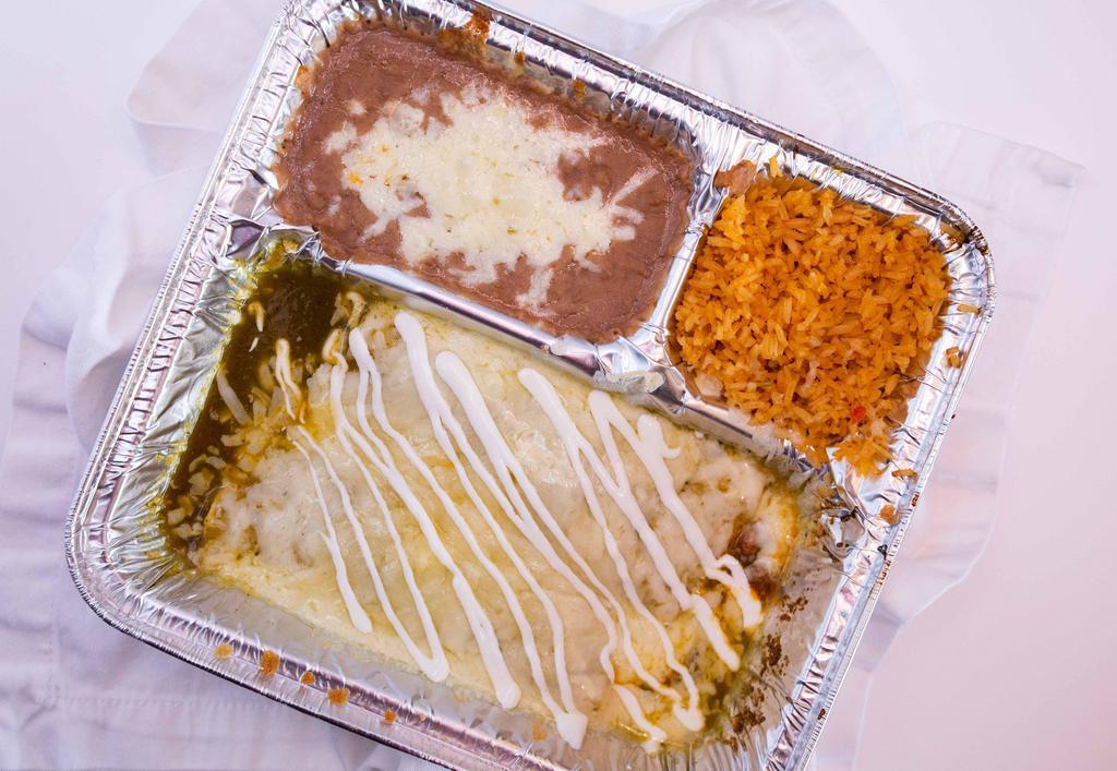 Enchiladas Verdes · Two enchiladas filled with your choice of chicken, picadillo ground beef, or cheese. Topped with melted cheese, salsa verde, and drizzled with sour cream.