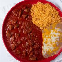 Chile Colorado · Tender steak pieces stewed in our homemade chili pasilla colorado salsa. Served with tortill...