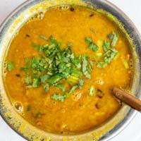 Yellow Daal · Yellow lentils cooked with onion, tomato, garlic, ginger and spices.