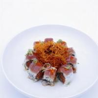 N.T Roll · Spicy tuna, cucumber inside with tuna, fried carrot on top served with spicy garlic ponzu an...