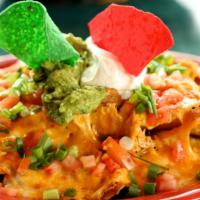 Super Nachos With Meat · Corn tortilla chips with refried beans, choice of ground beef, or chicken, melted cheese, ch...
