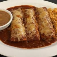 Beef Enchiladas · Choose two or three ground beef enchiladas with red chile sauce. Served with Mexican rice an...