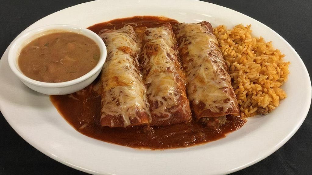Beef Enchiladas · Choose two or three ground beef enchiladas with red chile sauce. Served with Mexican rice and frijoles a la charra.