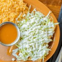 Flautas De Pollo · 3 corn tortillas filled with chicken, rolled up and fried - topped with lettuce, sour cream,...