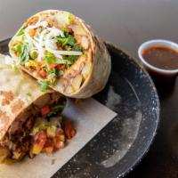 Montana Burrito · Thirteen-inch flour tortilla (pork adobada), potato, beans, cheese, cilantro, grilled onions...