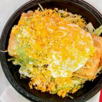07 Chimichanga Plate (Chicken Or Beef) · Deep-fried burrito with refried beans, cheese, and choice of meat (chicken or beef) inside. ...