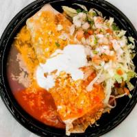 Chicken Smothered Burrito
 · Shredded chicken with rice and beans inside. topped with red or green enchilada sauce, chees...