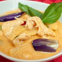 Red Curry · Red curry paste, coconut milk, bamboo shoot, bell pepper, and basil leaves with rice.