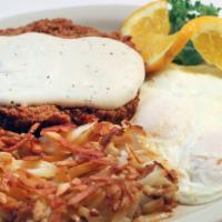 Chicken Fried Steak · Topped with country gravy, two eggs, hash browns and toast.