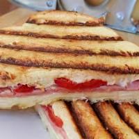Chicken Caprese Panini · Chicken, mozzarella, tomatoes & balsamic reduction. Comes with a small salad, cookie & potat...