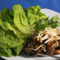 Ginger Chicken Lettuce Wraps · Wok seared ginger chicken, braised shiitake mushrooms & water chestnuts served with tender b...