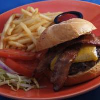 Coho Cafe Burger · Hand formed patty, aged white cheddar, secret sauce, lettuce, tomato & onion on a Macrina Ba...