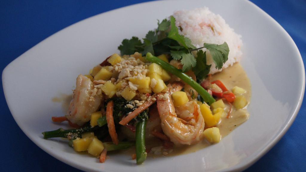 Coconut-Green Curry With Ginger-Jasmine Rice · Stir fried Asian veggies, spicy coconut curry sauce, mango & peanuts.