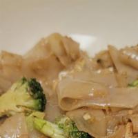 Pad Se-Lew · Fat noodles with broccoli and egg in black sweet soy. Add chicken, beef, tofu, shrimp for an...