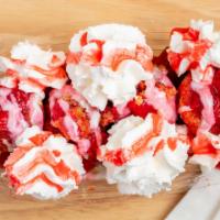 Strawberry Shortcake Deluxe Donut Boat · Donuts with White Icing, Strawberry Syrup, Strawberry bits, and topped with Whipped Cream