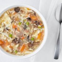 Egg Flower Soup · Egg flower with peas, carrots, mushrooms, and tomatoes.