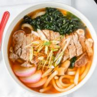 Niku Udon · Japanese noodle soup with grilled steak, shiitake mushrooms, seaweed, fish cake and scallions.