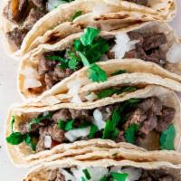 Carne Asada Taco Order · Four tacos at the meat of your choice, with red or green chili sauce.