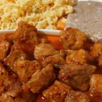 Asado De Puerco Plate · All plates served with salad, rice, beans, corn or flour tortillas and red or green chili sa...