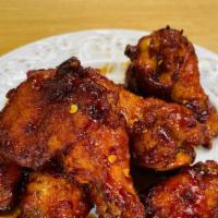 Thai Hot Wings · 7 pieces of chicken wings tossed in spicy ThaiDash's Hot Wings Sauce. The Sauce contains Sri...