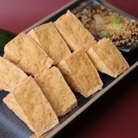 Fried Tofu · 8 Pieces of Fried crispy tofu served with ThaiDash's sweet sauce topped with ground peanut.