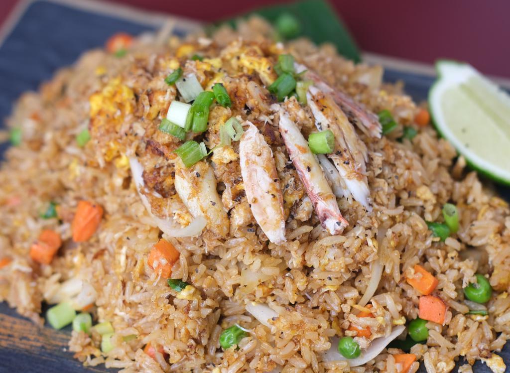 Crab Fried Rice · Stir-fried rice with pea, carrot, onion, real crab meat, and egg.