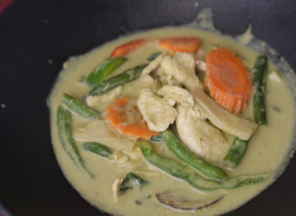Green Curry · Green curry paste, coconut milk, bamboo shoot, carrot, bell pepper, basil, and Chinese eggplant. Served with Jasmine Rice. (32 oz)