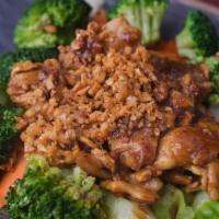 Garlic · Stir-fried choice of meat, garlic on a bed of steamed carrot, broccoli, and cabbage. Served ...