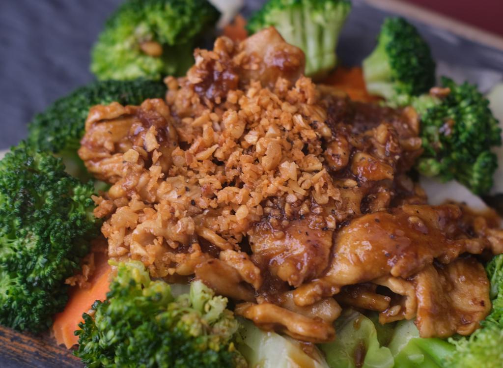 Garlic · Stir-fried choice of meat, garlic on a bed of steamed carrot, broccoli, and cabbage. Served with Jasmine Rice.