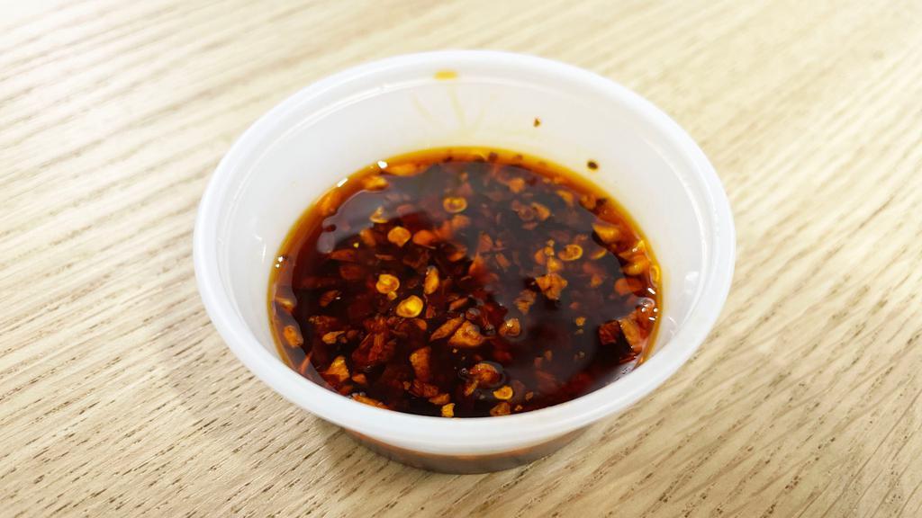 Chili Oil · Soybean oil infused with Thai Herbs mixed with spices and Thai dried chili. Very spicy!!!
