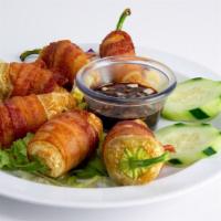 Toritos De Camaron (6) · yellow peppers stuffed with shrimp and cheese, wrapped in bacon
