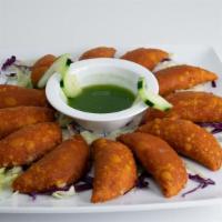Empanadas De Camaron Con Queso (12) · fried pastry filled with shrimp and cheese