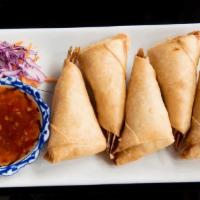 Blanket Prawns · Deep fried prawns with ground chicken wrapped in spring roll wrapper. Served with sweet chil...