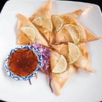 Lime Chicken · Marinated ground chicken wrapped in spring roll wrapper. Deep fried and finished with orange...