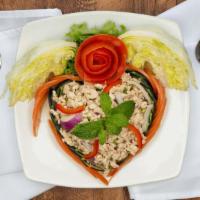 Larb Gai · Ground chicken tossed with cilantro, green onion, red onion and roasted rice in lime and fis...