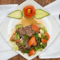 Beef Salad · Wok-fried sliced beef, red and green onion, cucumber, tomato and cilantro tossed in lime and...