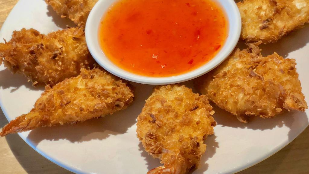Coconut Prawns 5 Pcs · Flash fried Black Tiger shrimp dipped in coconut flakes and panko served with Thai sweet chili sauce  5 prawns