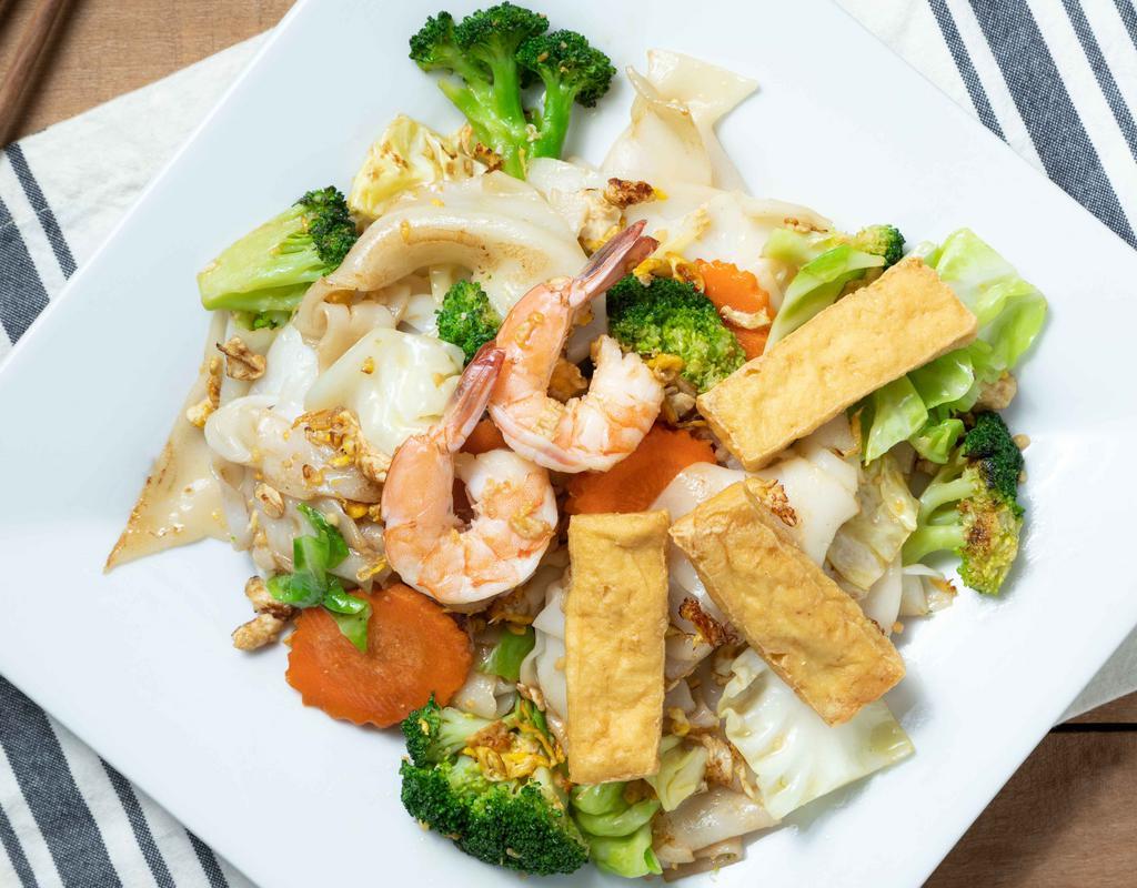 Phad See Lew Our Favorite · Wide rice noodle, stir-fried with light sweet soy sauce, egg, broccoli, carrot, cabbage