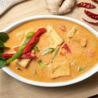 Panang Curry Served With Rice · Spiced curry in rich creamy coconut milk, bell pepper, basil, kaffir lime leaves served with...