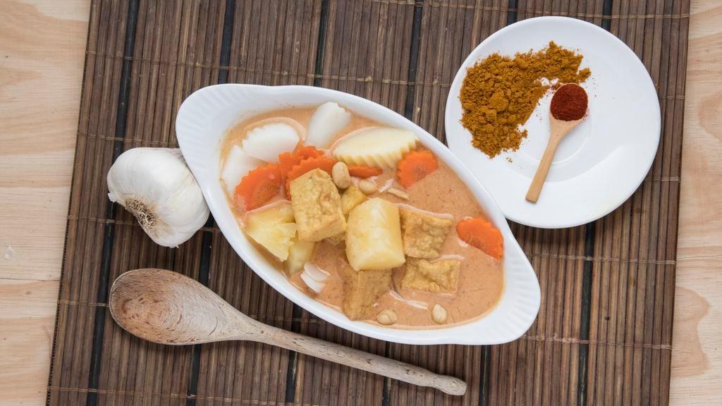 Massaman Curry Served With Rice · Massaman curry, pineapple, potato, carrot, tamarind puree