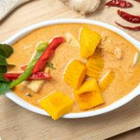 Pineapple Prawn Curry Served With Rice · Spicy red curry sauce, pineapple, coconut milk, prawn, basil, kaffir lime leaves