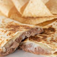 Bean And Cheese Quesadilla · Flour tortilla with melted Monterey Jack cheese and refried beans.