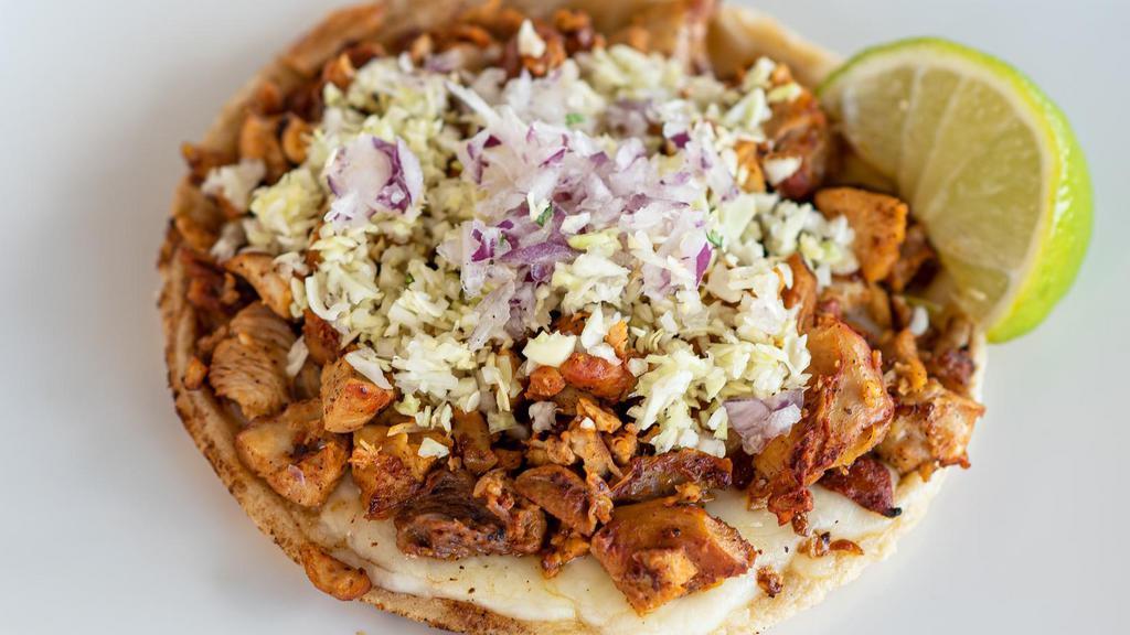 Chicken Gordita · Handmade corn tortilla topped with Monterey Jack cheese, mesquite grilled chicken, diced cabbage and diced red onion.