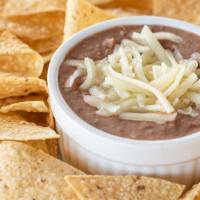 Chips And Beans · Refried Beans topped with Monterey Jack Cheese and served with corn tortilla chips.