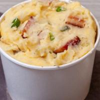 Loaded Mashed Potatoes · Creamy mashed potatoes loaded with smoky bacon, cheddar cheese and green onions.