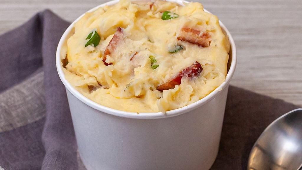 Loaded Mashed Potatoes · Creamy mashed potatoes loaded with smoky bacon, cheddar cheese and green onions.