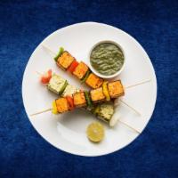 Cottage Cheese Tikka · Fresh cottage cheese cubes seasoned in a yogurt tandoori marinade, skewered and grilled in a...
