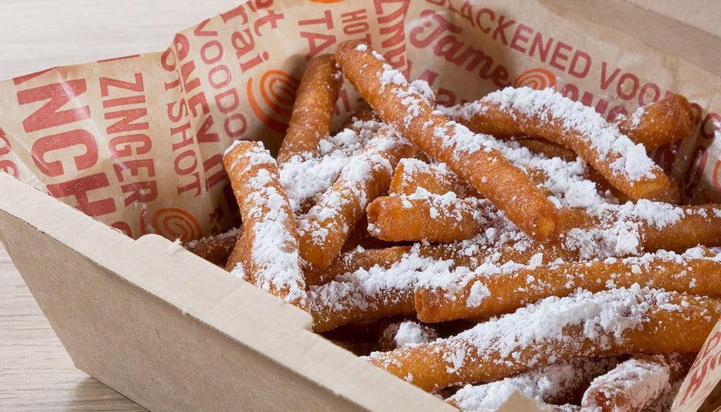 Funnel Cake Fries · Funnel cake goodness in an easy to eat dessert. Sweet funnel cake dough fried to crispy perfection and topped off with powdered sugar.